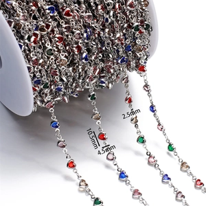 Macro detail of multicolored heart-shaped crystal rhinestone chain for DIY jewelry craft