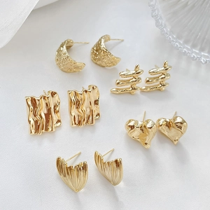 Irregular textured 14k gold plated stud earrings set with heart and geometric patterns