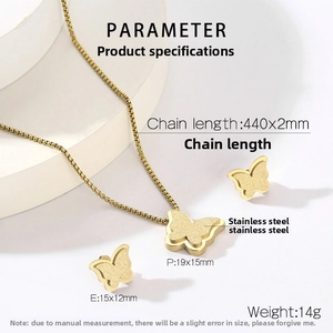 Detailed macro view of gold butterfly necklace and earrings set on white display