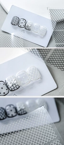 Detailed 5D embossed nail art stickers with white bows and lace patterns on display card