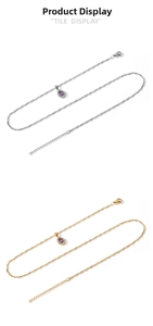 Détail de pendentifs goutte en zircon violet sur chaînes torsadées dorées et argentées
