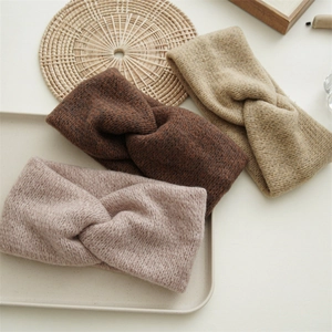 Three twisted knit headbands in coffee, camel, and tan tones for autumn and winter style