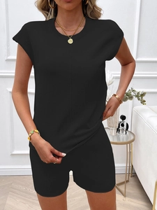 Close-up of black knitted two-piece set featuring sleeveless round neck top and shorts