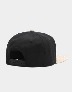 Detail view of the black and khaki snapback hat featuring an adjustable plastic closure