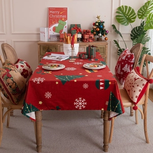 Red Christmas tablecloth with festive tree and snowflake patterns on soft velvet fabric