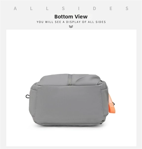 Detailed bottom view of the large gray fabric backpack with reinforced stitching and orange accents