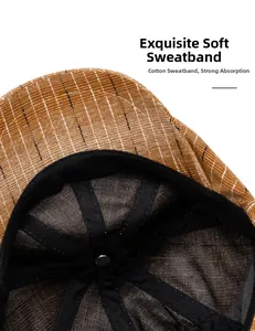 Detail of the soft cotton inner sweatband on a striped brown newsboy cap for men