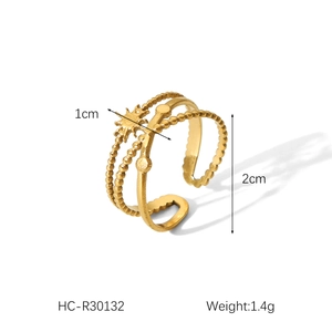 Detail view of 18K gold plated triple layered ring with sunburst charm and 1.4g weight