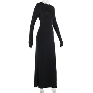 Detail of elegant black long sleeve bodycon dress showing the slim fit silhouette and fabric