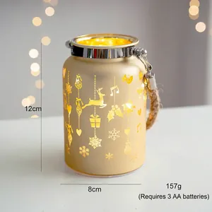 Detail of 12cm champagne gold Christmas lantern with reindeer and snowflake cutouts