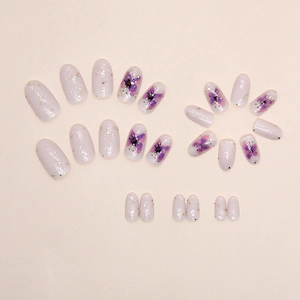 Sparkly purple butterfly press-on nail set with glitter finish and oval shape design