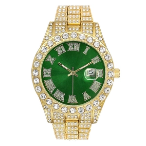Detail of hip hop watch with iced-out crystals and a green sunray dial and gold finish