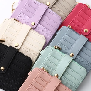 Macro shot of colorful woven silicone wallets with golden zippers and wristlets