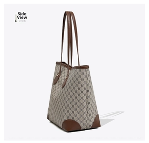 Detailed side view of large capacity tote bag featuring retro pattern and leather trim