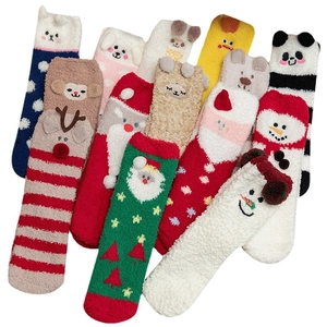 Plush Christmas socks set featuring reindeer, Santa and snowman designs in soft coral fleece