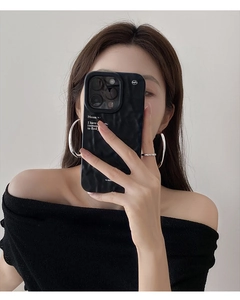 Detail of minimalist large silver hoop earrings and a slim ring on a fashion model
