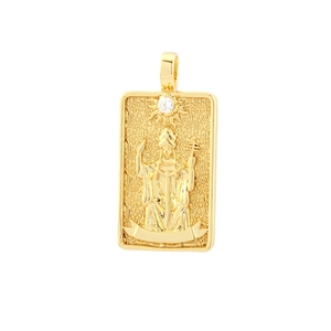 Macro shot of gold tarot pendant featuring the Hierophant design with white zircon stone