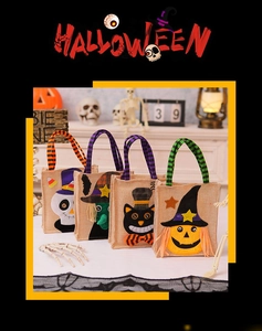 Detail view of four burlap Halloween candy bags featuring pumpkin, skull, and witch designs