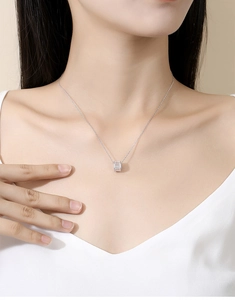 Detail of S925 sterling silver cylinder pendant necklace with sparkling zircon stones