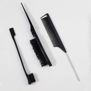 Detailed view of 3-piece professional hair styling set with teasing brush and edge control tool