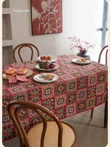 Macro detail of red geometric jacquard tablecloth with soft, wearproof fabric texture