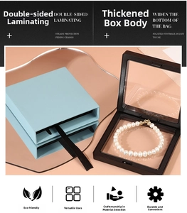 Macro view of blue PE film jewelry box with pearl bracelet for floating display
