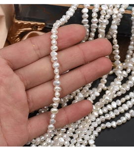 Macro shot of natural baroque freshwater pearls with side holes for jewelry making