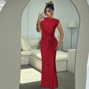 Detail of red sleeveless maxi dress showing the cross-pleated waist and slim-fit texture