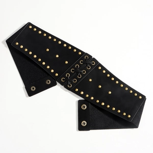 Detail of black PU leather corset belt featuring gold rivets and lace-up front design