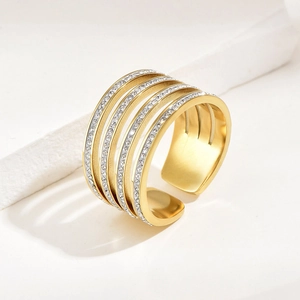 Detailed macro view of gold multi-layer adjustable ring with sparkling zircon stones