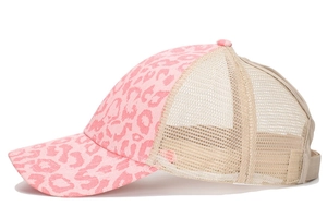 Side view of pink leopard print trucker hat with breathable beige mesh back