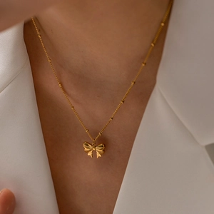 Elegant 18K gold-plated stainless steel bead chain necklace with butterfly pendant worn on neck