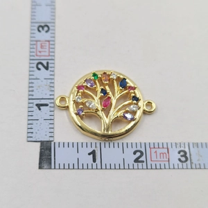 Detailed size measurement of a gold tree of life pendant with colorful zircon stones