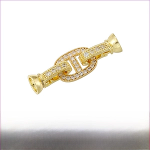 Detail of 18K gold-plated brass pig nose clasp with cubic zirconia pavé and star charm