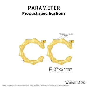Detail view of gold C-shaped bamboo earrings with 37x34mm dimensions and weight specs