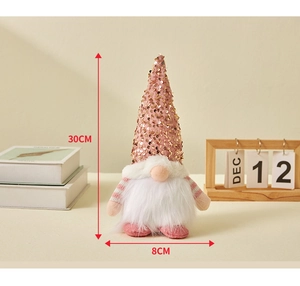 Christmas gnome plush with pink sequin hat showing 30cm height and 8cm width dimensions