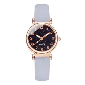 Women's rose gold quartz watch with starry blue dial and grey leather strap