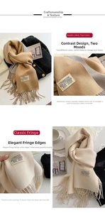 Detail of solid color double-sided cashmere scarf with classic fringe and woven label
