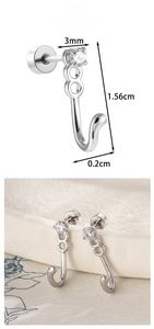 Macro detail of J-shaped cat tail ear stud with 3mm round zircon in polished titanium steel
