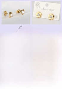 Detail of 18K gold-plated titanium steel earrings with flower and heart stud designs