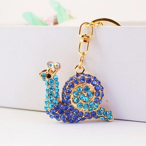 Cute snail keychain with blue rhinestones and gold-plated metal clasp for bags