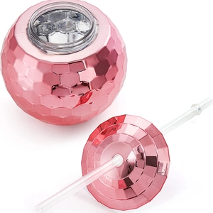 Pink electroplated disco ball cup with lid and straw on a white background