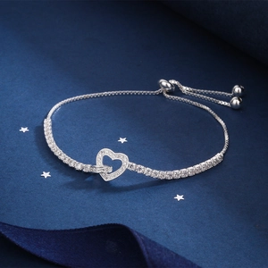 Detail of adjustable heart zircon bracelet showing the slide clasp and star-themed backdrop