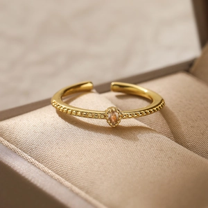 Macro shot of 18K gold plated zircon ring set in a premium jewelry gift box
