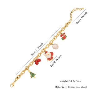 Bracelet à breloques de Noël en acier inoxydable avec pendentifs sapin père Noël et détails.
