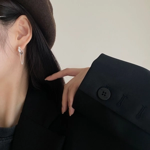 Elegant 925 sterling silver tassel chain drop earring on a female model wearing a beret