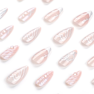 3D water ripple press-on nails in light pink with pearl finish and abstract white lines