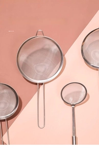 Various sizes of stainless steel fine mesh strainers with long handles for kitchen filtering