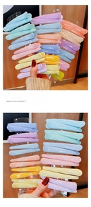 Close-up of colorful acrylic hair clips in pastel shades for hairstyling and makeup