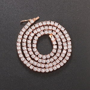 Detailed macro view of rose gold tennis chain with clear cubic zirconia on black background